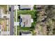 This is a bird's eye view of a house with trees and lawn; also view of the street and nearby houses at 7116 Brookline Pl, Huntersville, NC 28078