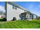 Well-maintained backyard featuring a lawn, patio, and a view of the house's exterior at 7116 Brookline Pl, Huntersville, NC 28078