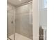 This bathroom offers a large tile shower with a glass door, and a chrome shower head and faucet at 7116 Brookline Pl, Huntersville, NC 28078