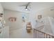 This cozy bedroom has a rocking chair, crib, side table, decor, window, and carpet at 7116 Brookline Pl, Huntersville, NC 28078