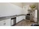 Modern kitchen featuring stainless steel appliances, white cabinets, granite countertops, and hardwood floors at 7116 Brookline Pl, Huntersville, NC 28078