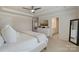 Relaxing main bedroom featuring a tray ceiling, carpeting, and an ensuite bathroom entrance at 7116 Brookline Pl, Huntersville, NC 28078