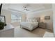 Spacious main bedroom with a tray ceiling, plush carpeting, and neutral décor at 7116 Brookline Pl, Huntersville, NC 28078