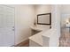 A dedicated office nook by the entrance features a sleek countertop and a modern design at 7116 Brookline Pl, Huntersville, NC 28078