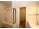 Clean bathroom with a tub and shower combination and a closet at 8606 Highgate Dr, Charlotte, NC 28215