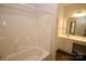 Bright bathroom featuring a tub/shower combination and modern vanity at 8606 Highgate Dr, Charlotte, NC 28215