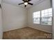 Cozy bedroom featuring natural light from a large window at 8606 Highgate Dr, Charlotte, NC 28215