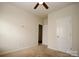 Cozy bedroom featuring a ceiling fan and ample closet space at 8606 Highgate Dr, Charlotte, NC 28215