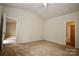 Spacious carpeted bedroom featuring a vaulted ceiling and neutral color palette at 8606 Highgate Dr, Charlotte, NC 28215