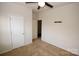 Neutral bedroom featuring a ceiling fan and ample closet space at 8606 Highgate Dr, Charlotte, NC 28215