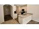 Well-lit kitchen featuring granite countertops, white cabinetry, and modern appliances at 8606 Highgate Dr, Charlotte, NC 28215