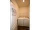 Convenient laundry room with appliances and a self-service sign at 8606 Highgate Dr, Charlotte, NC 28215