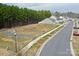 Street view of the sidewalk and road surrounded by homes and wooded area at 8606 Highgate Dr, Charlotte, NC 28215