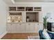 Stylish bar area with built-in shelves, wine rack, and wet bar at 8915 Linden Grove Ct, Sherrills Ford, NC 28673