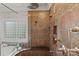 This bathroom features multi-head shower, seamless glass, a built-in bench, and attractive tile at 8915 Linden Grove Ct, Sherrills Ford, NC 28673