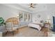Bright bedroom with natural light, wicker chair, and cozy decor at 8915 Linden Grove Ct, Sherrills Ford, NC 28673