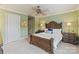This bedroom offers a ceiling fan, neutral walls, and an ensuite bathroom at 8915 Linden Grove Ct, Sherrills Ford, NC 28673