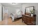 Guest bedroom featuring tiled floors, dresser and colorful bedding at 8915 Linden Grove Ct, Sherrills Ford, NC 28673