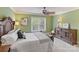 This bedroom offers neutral walls, a ceiling fan, and bright natural light at 8915 Linden Grove Ct, Sherrills Ford, NC 28673