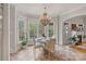 Bright breakfast nook with natural light, backyard views, and a cozy fireplace at 8915 Linden Grove Ct, Sherrills Ford, NC 28673