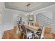 Spacious dining room with hardwood floors, elegant lighting, and staircase access at 8915 Linden Grove Ct, Sherrills Ford, NC 28673
