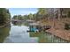 Lakefront property featuring a private dock with boat slip, stairs and adjacent deck for entertaining at 8915 Linden Grove Ct, Sherrills Ford, NC 28673
