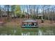 Waterfront property with a private covered dock, lounge chairs, and stunning lake views at 8915 Linden Grove Ct, Sherrills Ford, NC 28673