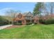 Beautiful brick home with manicured landscaping and a lush green lawn in a desirable neighborhood at 8915 Linden Grove Ct, Sherrills Ford, NC 28673