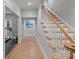 The downstairs hallway offers tile floors and access to an exercise room and staircase at 8915 Linden Grove Ct, Sherrills Ford, NC 28673