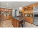 Gourmet kitchen featuring custom cabinets, stone countertops, and stainless steel appliances at 8915 Linden Grove Ct, Sherrills Ford, NC 28673