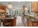 Gourmet kitchen with custom cabinets, stainless steel appliances, and adjacent dining area at 8915 Linden Grove Ct, Sherrills Ford, NC 28673