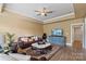 Comfortable living room with plush leather seating, area rug and tv at 8915 Linden Grove Ct, Sherrills Ford, NC 28673