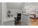Cozy home office space with a built-in desk and chair, with a glimpse into a bedroom with hardwood floors at 8915 Linden Grove Ct, Sherrills Ford, NC 28673