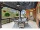 Inviting covered patio with stylish outdoor furniture, a ceiling fan, and views of the lake at 8915 Linden Grove Ct, Sherrills Ford, NC 28673
