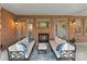 Covered patio with comfortable seating and a cozy fireplace, perfect for relaxing outdoors at 8915 Linden Grove Ct, Sherrills Ford, NC 28673
