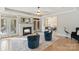 Cozy sunroom with fireplace, tiled floors, and comfortable seating at 8915 Linden Grove Ct, Sherrills Ford, NC 28673