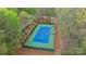 Aerial view of a community tennis court with green and blue surfacing and mature landscaping at 8915 Linden Grove Ct, Sherrills Ford, NC 28673