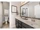 Modern bathroom with dual sinks, framed mirror, and updated fixtures, offering a clean and stylish design at 9422 Ridgeforest Dr, Charlotte, NC 28277