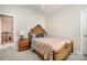 Cozy bedroom featuring carpeted floors, a ceiling fan, and a quaint window view at 9422 Ridgeforest Dr, Charlotte, NC 28277