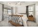 Bright bedroom featuring carpeted floors, a ceiling fan, and a large window view at 9422 Ridgeforest Dr, Charlotte, NC 28277