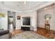 Open entryway showcasing hardwood floors, coat rack with storage, and views into other rooms at 9422 Ridgeforest Dr, Charlotte, NC 28277