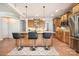 Charming kitchen featuring a large island with a breakfast bar and stainless steel appliances at 9422 Ridgeforest Dr, Charlotte, NC 28277