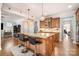Spacious kitchen with a large island with seating and granite countertops and wood floors at 9422 Ridgeforest Dr, Charlotte, NC 28277