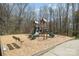 Community playground area featuring slides, climbing structures, and swings at 9422 Ridgeforest Dr, Charlotte, NC 28277