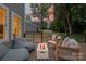 Cozy outdoor deck with a fire pit and comfortable seating, ideal for entertaining guests and enjoying the backyard at 9849 Rich Hatchet Rd, Huntersville, NC 28078