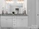 Bright bathroom features dual vanities with granite countertops, matching mirrors and ample storage at 9849 Rich Hatchet Rd, Huntersville, NC 28078