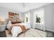 Sun-filled bedroom with plush carpeting, neutral decor, and bright windows with lovely views at 9849 Rich Hatchet Rd, Huntersville, NC 28078