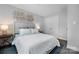 Relaxing bedroom features an upholstered headboard, side tables and lamps, and stylish decor at 9849 Rich Hatchet Rd, Huntersville, NC 28078
