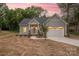 Charming single-Gathering home with a well-manicured lawn and a two-car garage, offering convenient parking at 9849 Rich Hatchet Rd, Huntersville, NC 28078