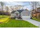 Charming single-Gathering home with a well-manicured lawn and inviting two-car garage, perfect for suburban living at 9849 Rich Hatchet Rd, Huntersville, NC 28078